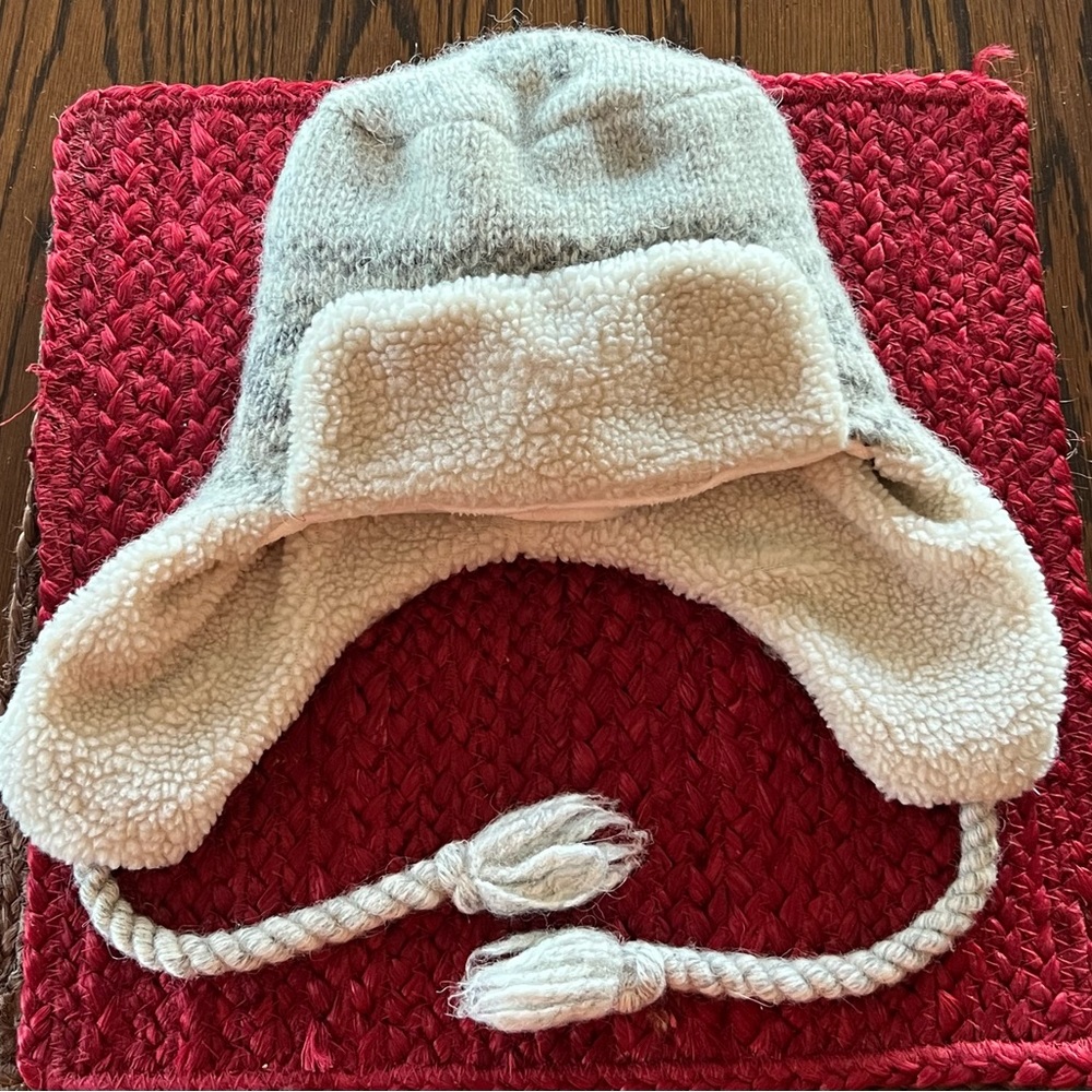 Knitted Child/Youth winter stocking cap with ear flaps.